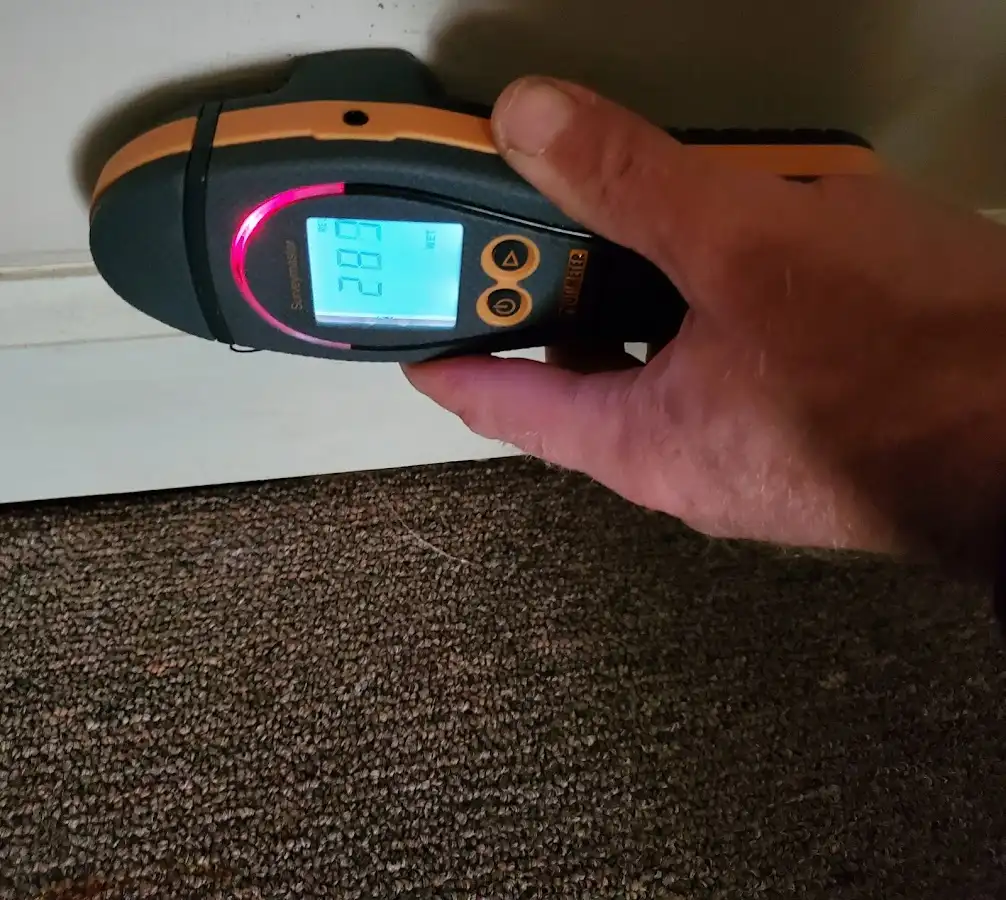 Moisture detection at baseboard during Storm Damage Restoration in Tracy